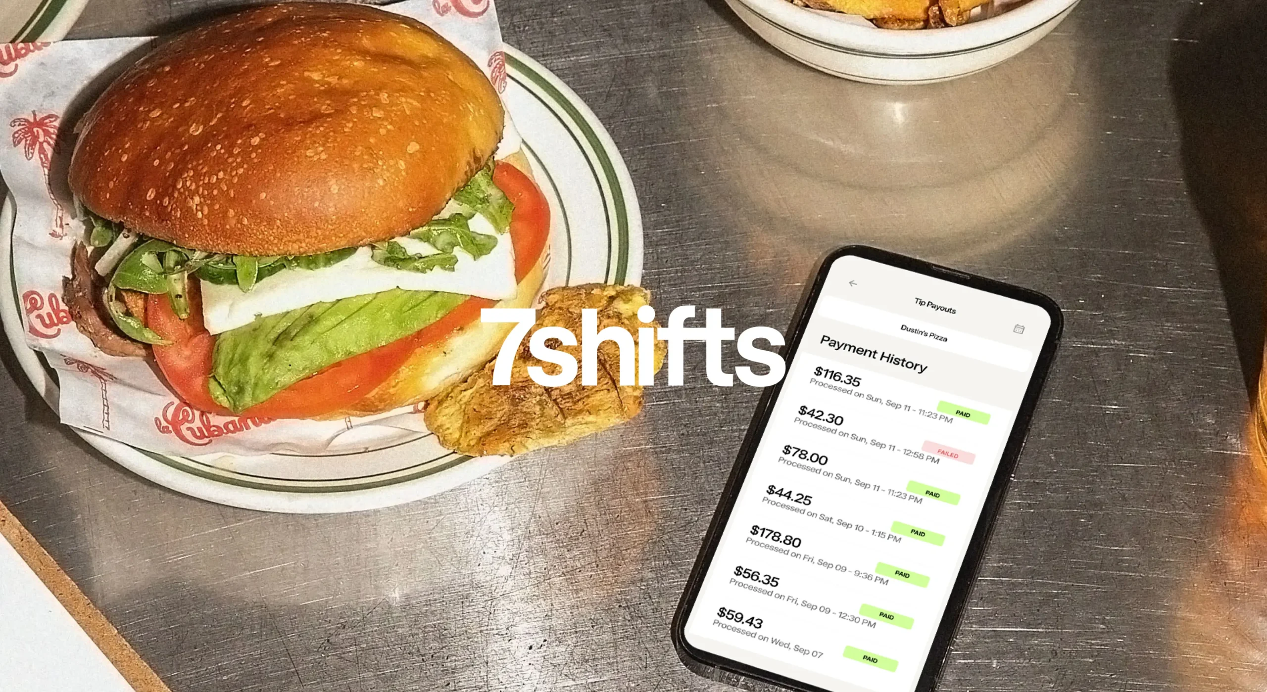 Phone on restaurant bar counter showing tip payouts on the screen